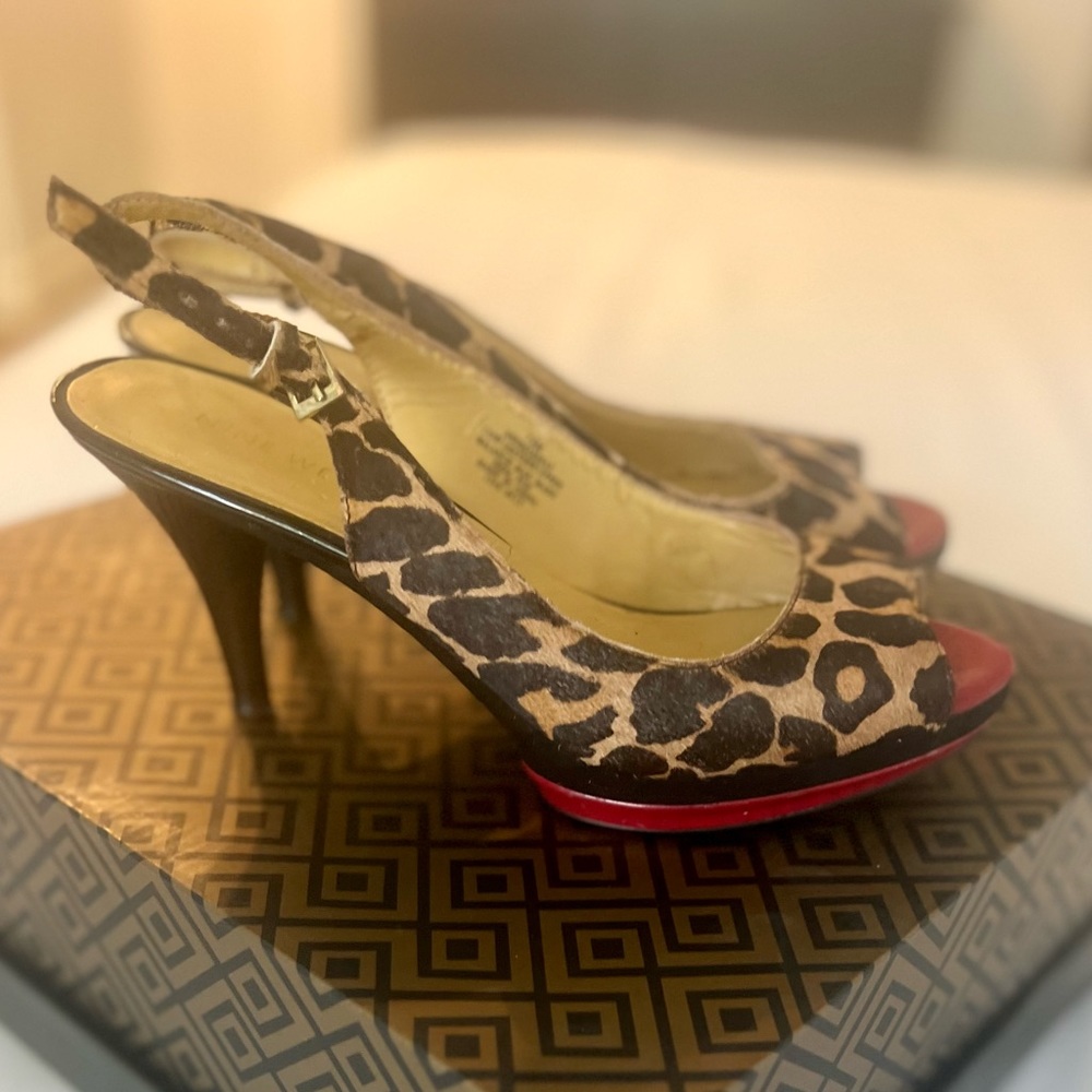 Nine West peep toe sling backs. Leopard print with red platform. Worn once.